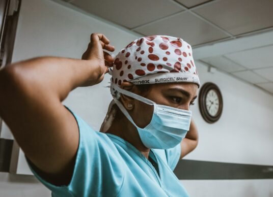 Nursing provider in mask and gown
